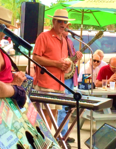 Kicking off the 14th Annual Pine Island Reader Rendezvous with the traditional sounding the conch on stage with The Yard Dogs band at Woody's Waterside Pub in St. James City, FL.